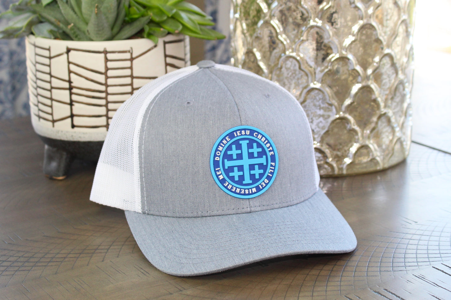 Heather gray and white snapback with a Blue Jerusalem Cross patch