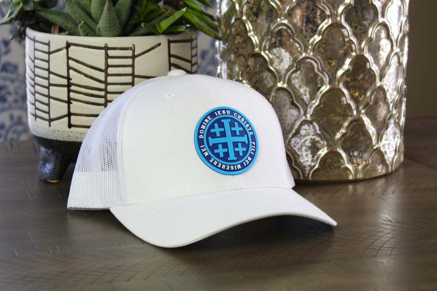 White snapback with a Blue Jerusalem Cross patch