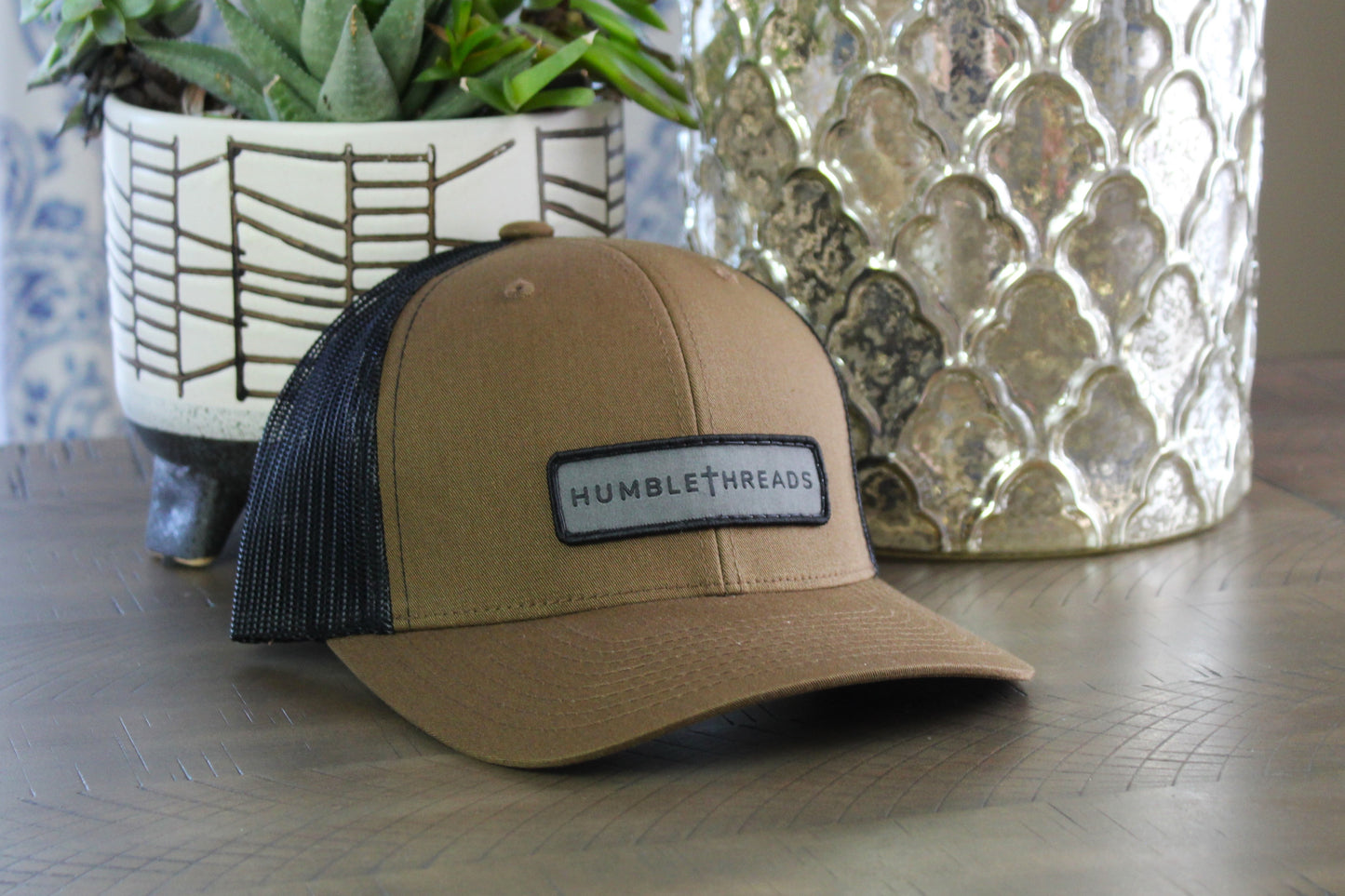 Coyote Brown/Black snapback with a humble threads patch