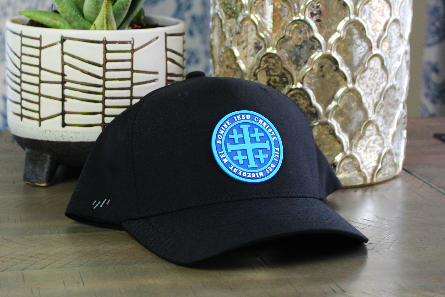 Black Flexfit with a Blue Jerusalem Cross patch