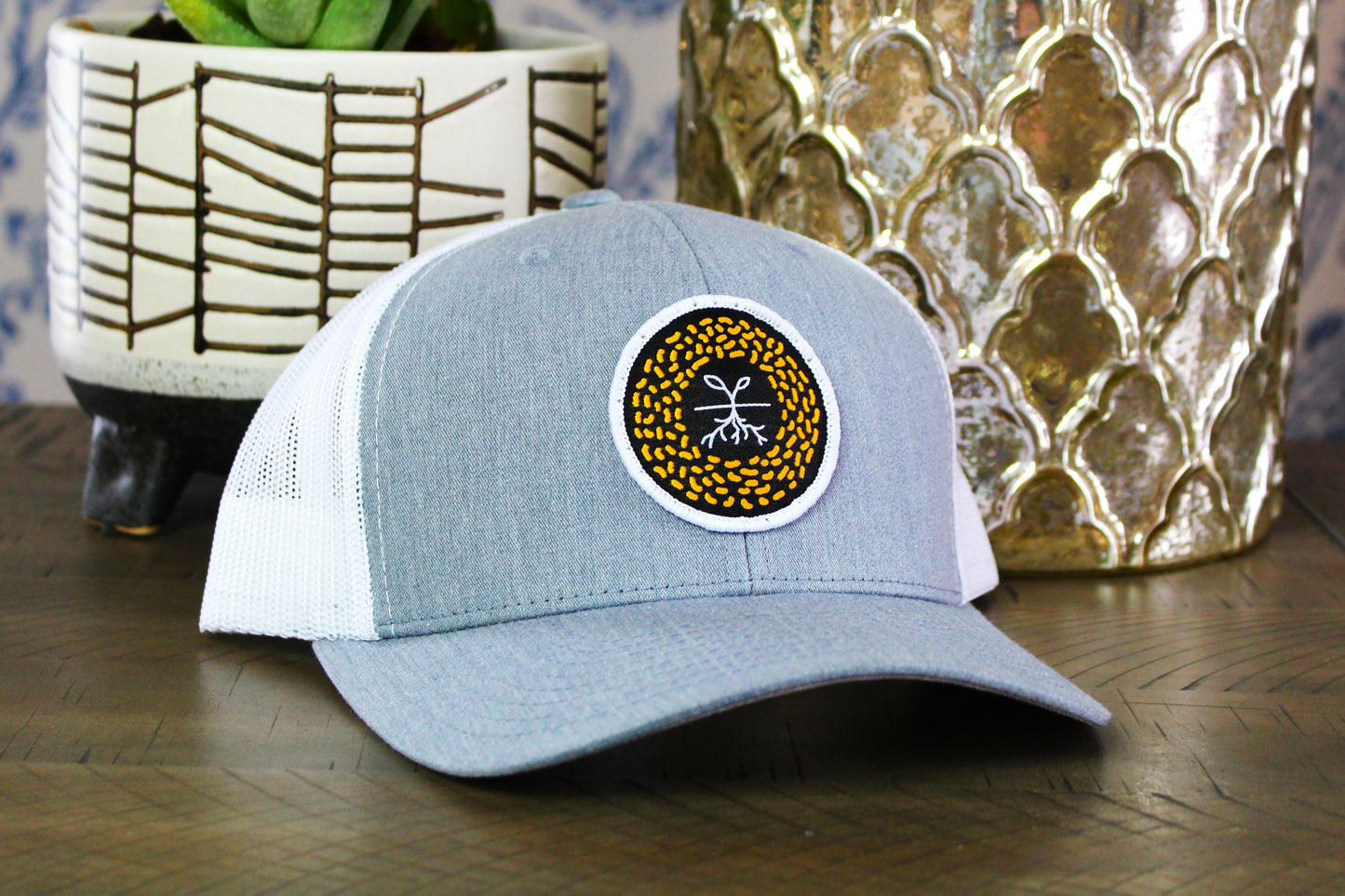 Heather gray/white snapback with a mustard seed patch