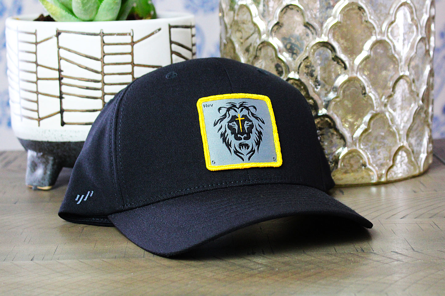 Black Flexfit Snapback with a lion patch