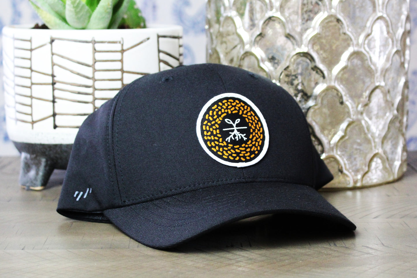 Black flexfit snapback with a mustard seed patch