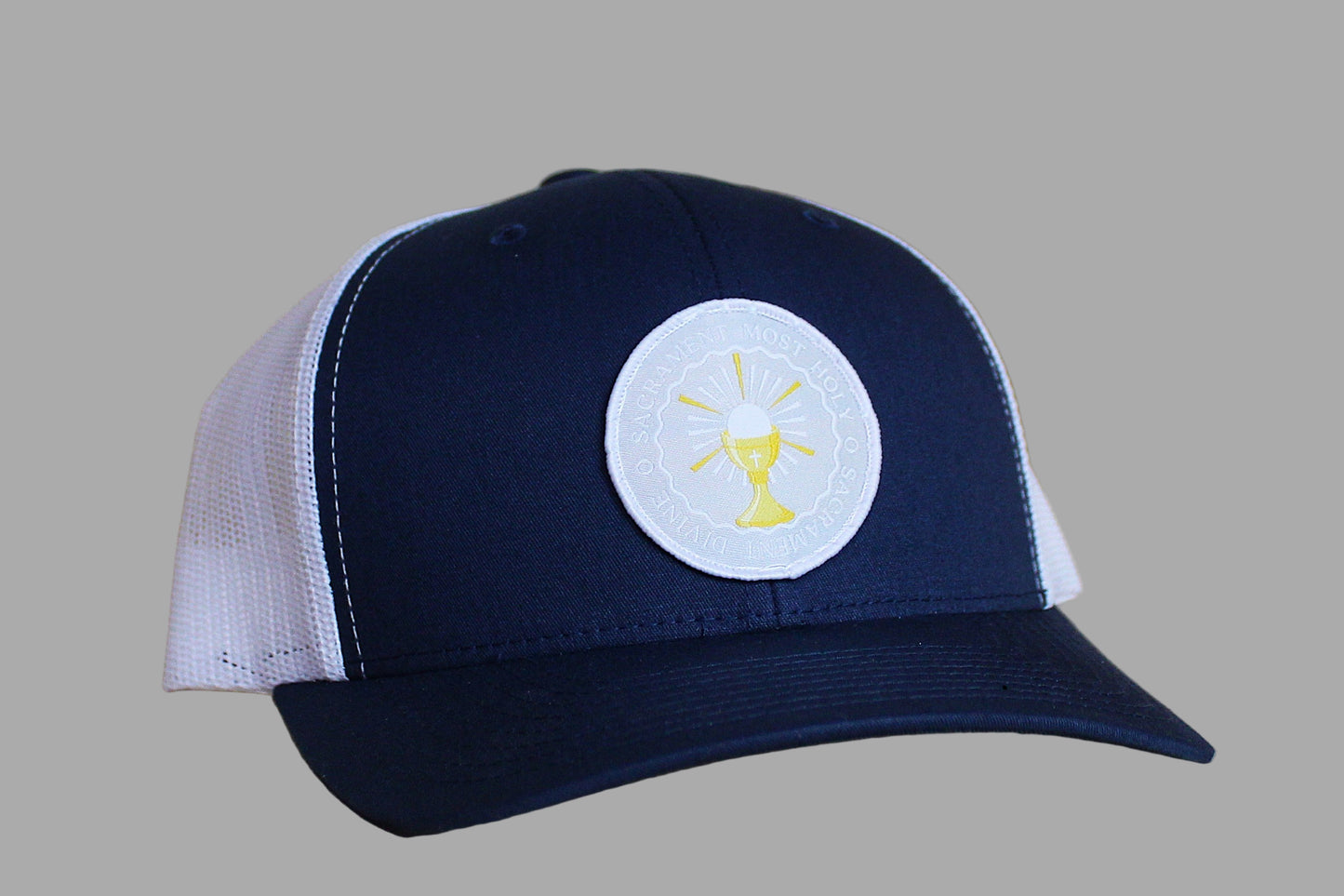 Navy and white cap with a logo on a wooden surface