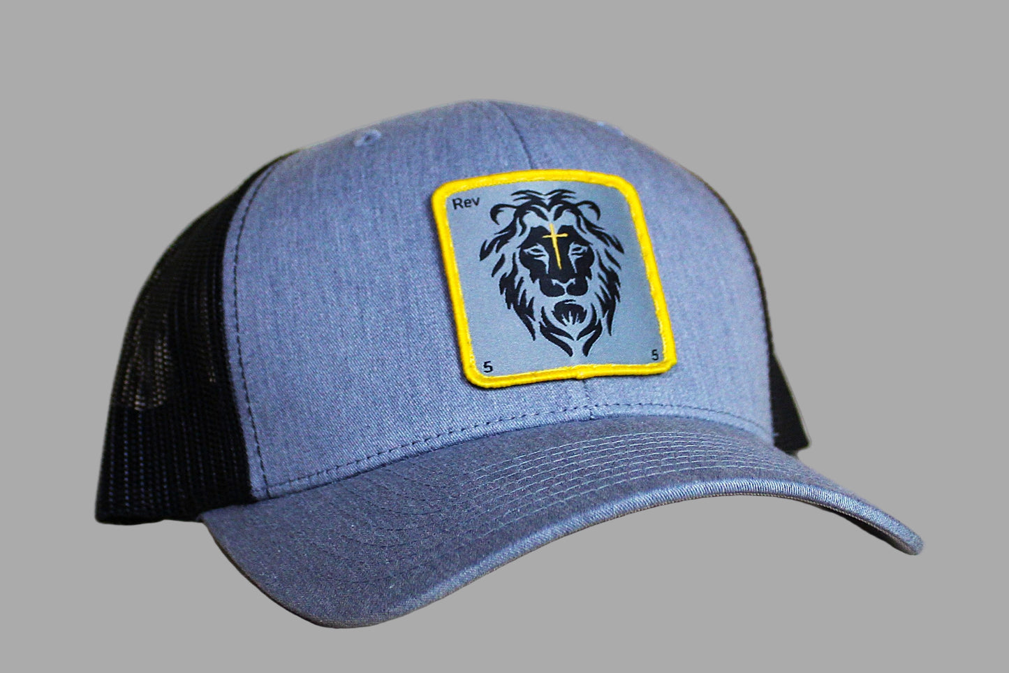 Blue and black cap with a lion emblem on a gray background