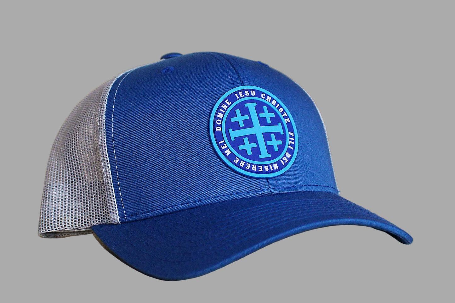Blue cap with a logo on a wooden surface