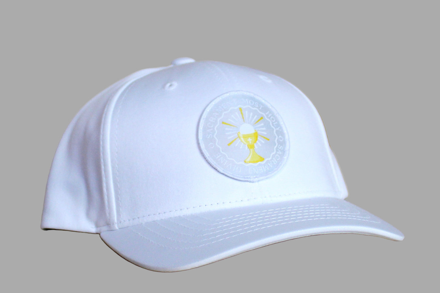 White cap with a logo on a wooden surface