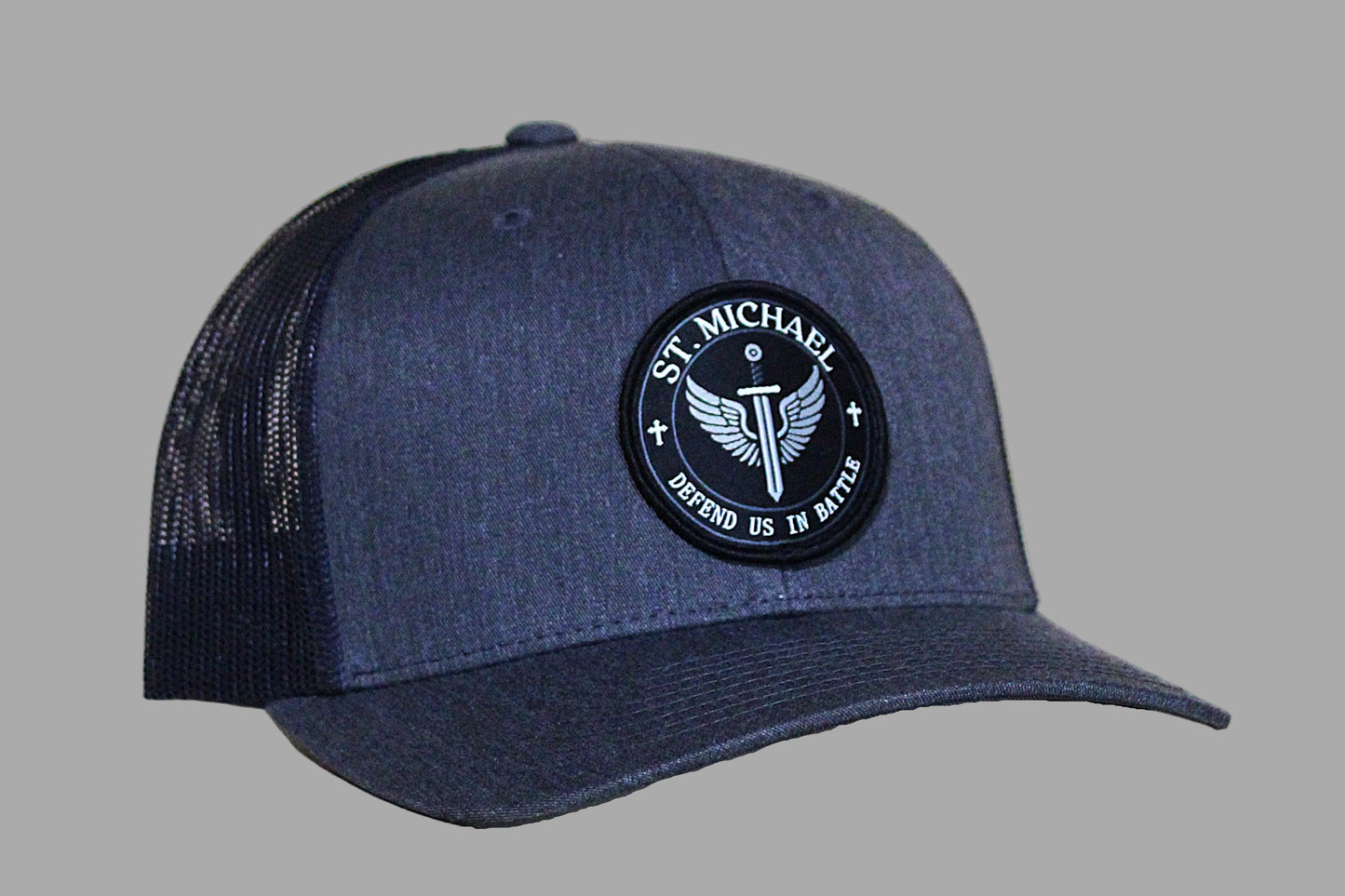 Gray/Black cap with a black emblem featuring 'St. Michael' on a black background