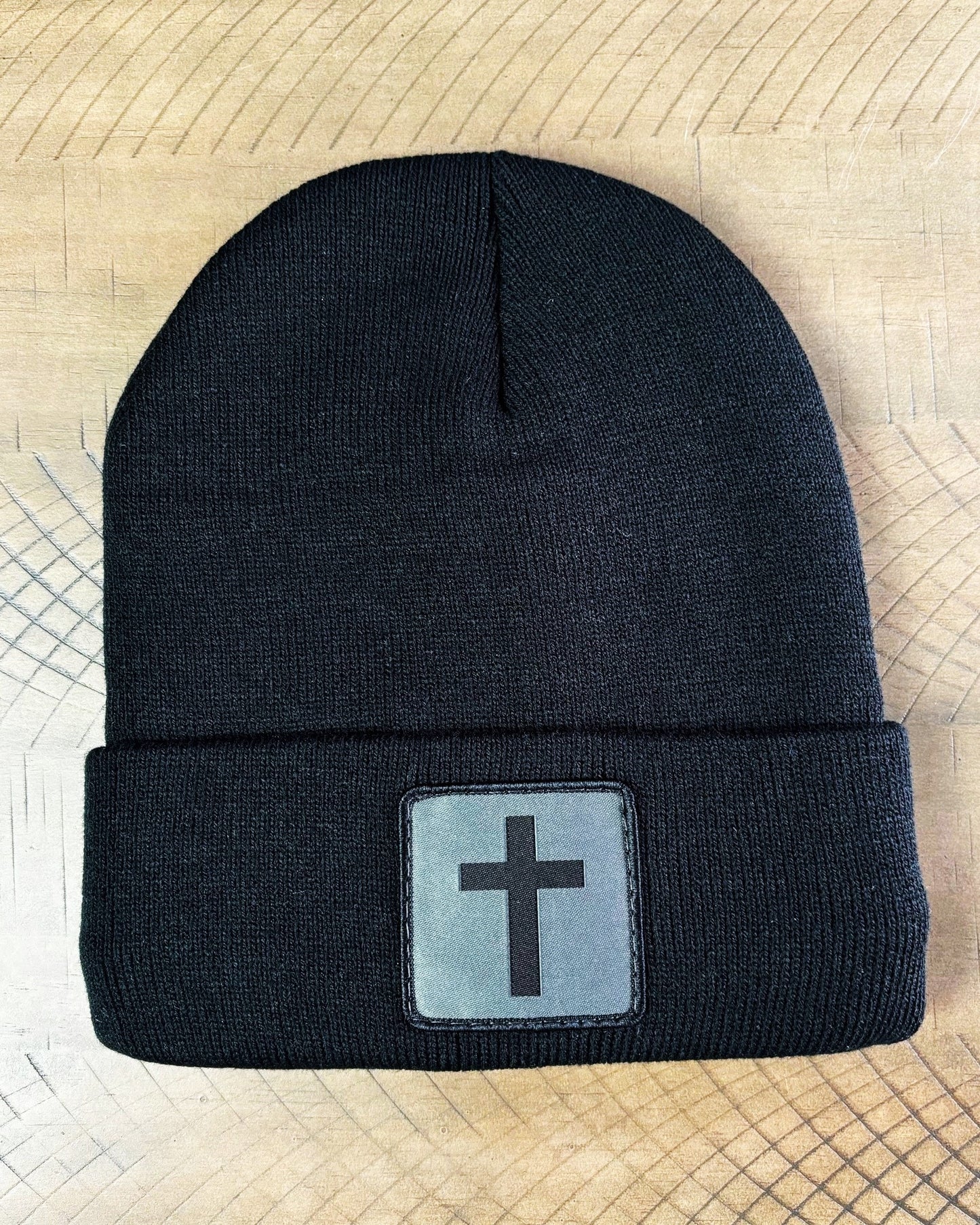 Black winter hat with humble threads cross patch