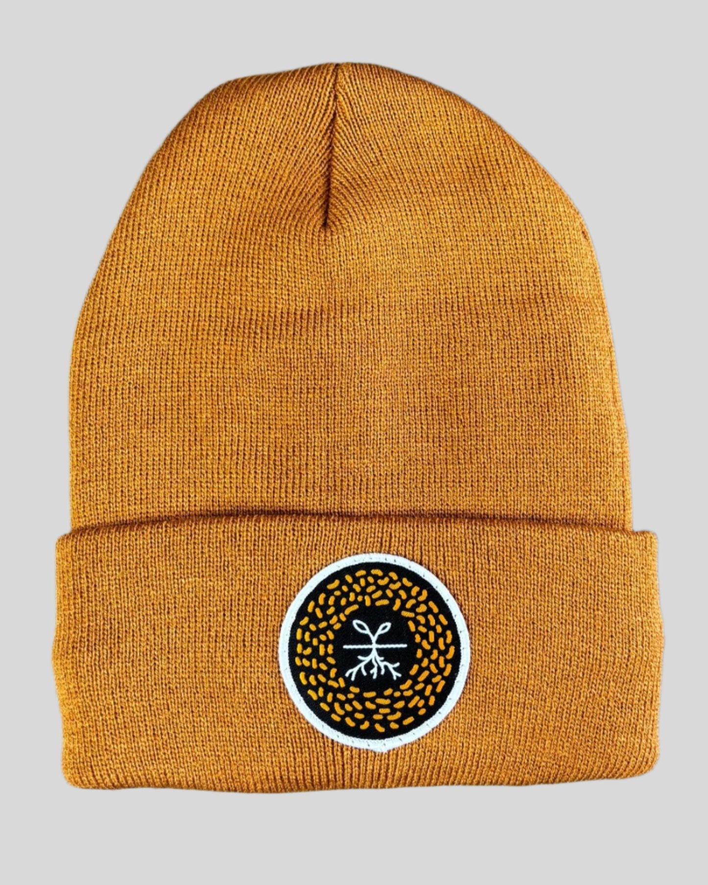 Carmel Brown winter hat with a mustard seed patch