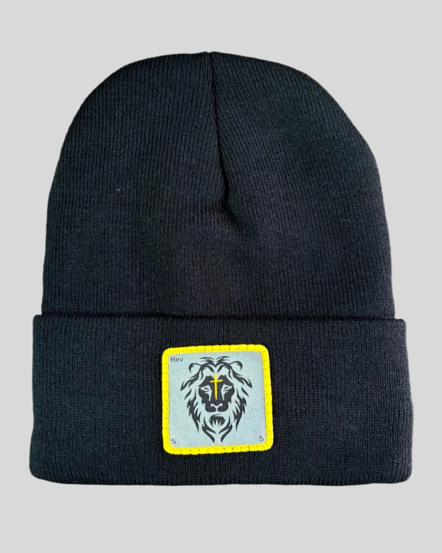 Black winter hat with a lion patch