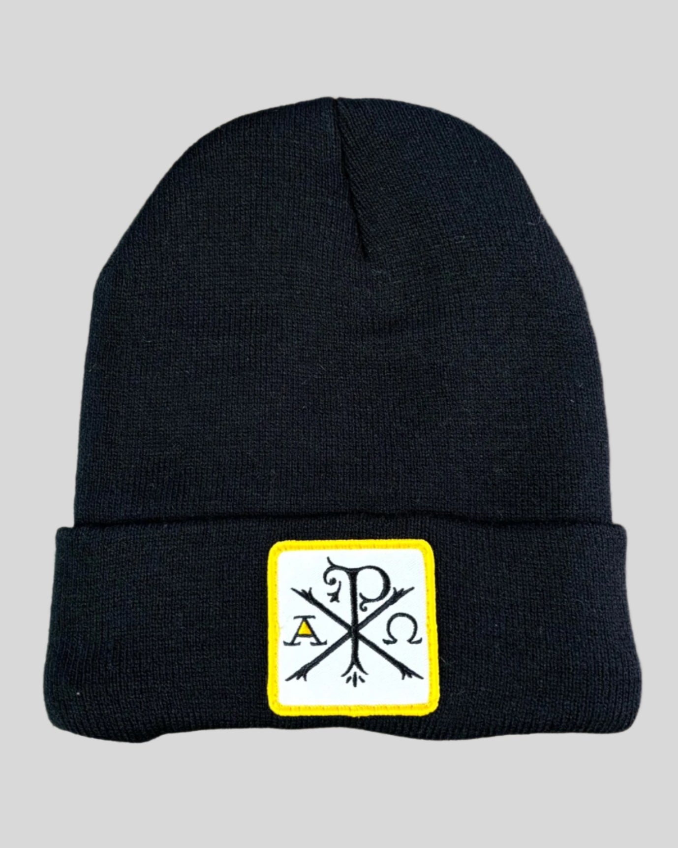 Black winter hat with a chi-rho patch