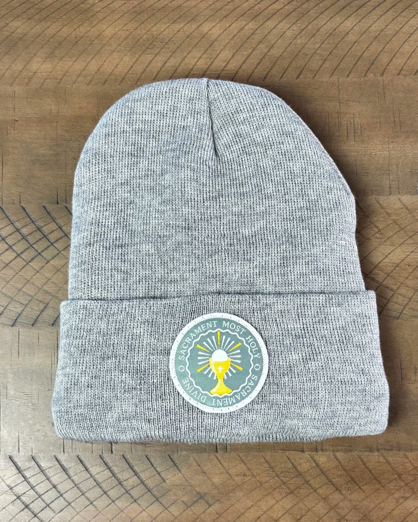 Heather gray winter hat with an O Sacrament Patch