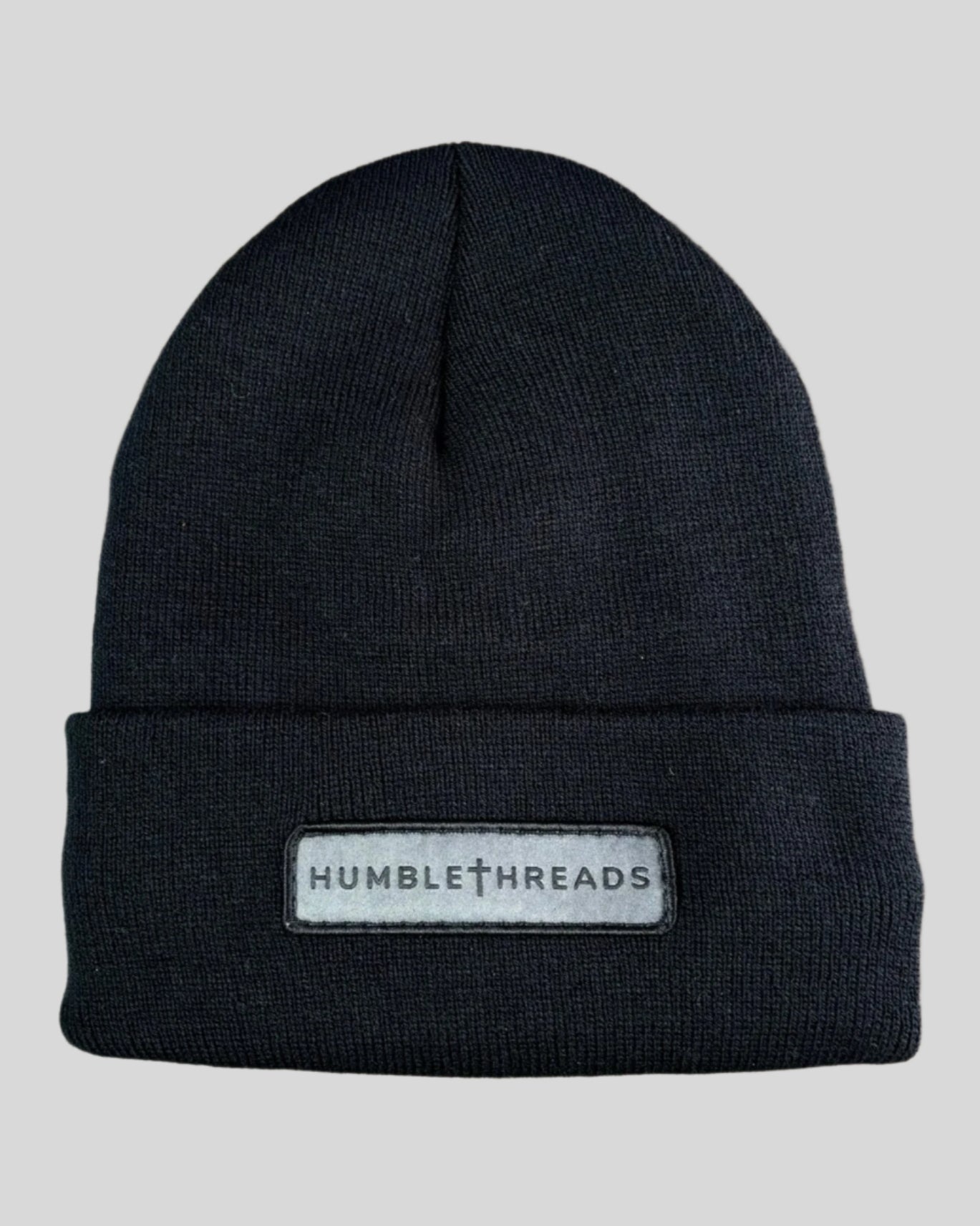 Black winter hat with a humble threads patch