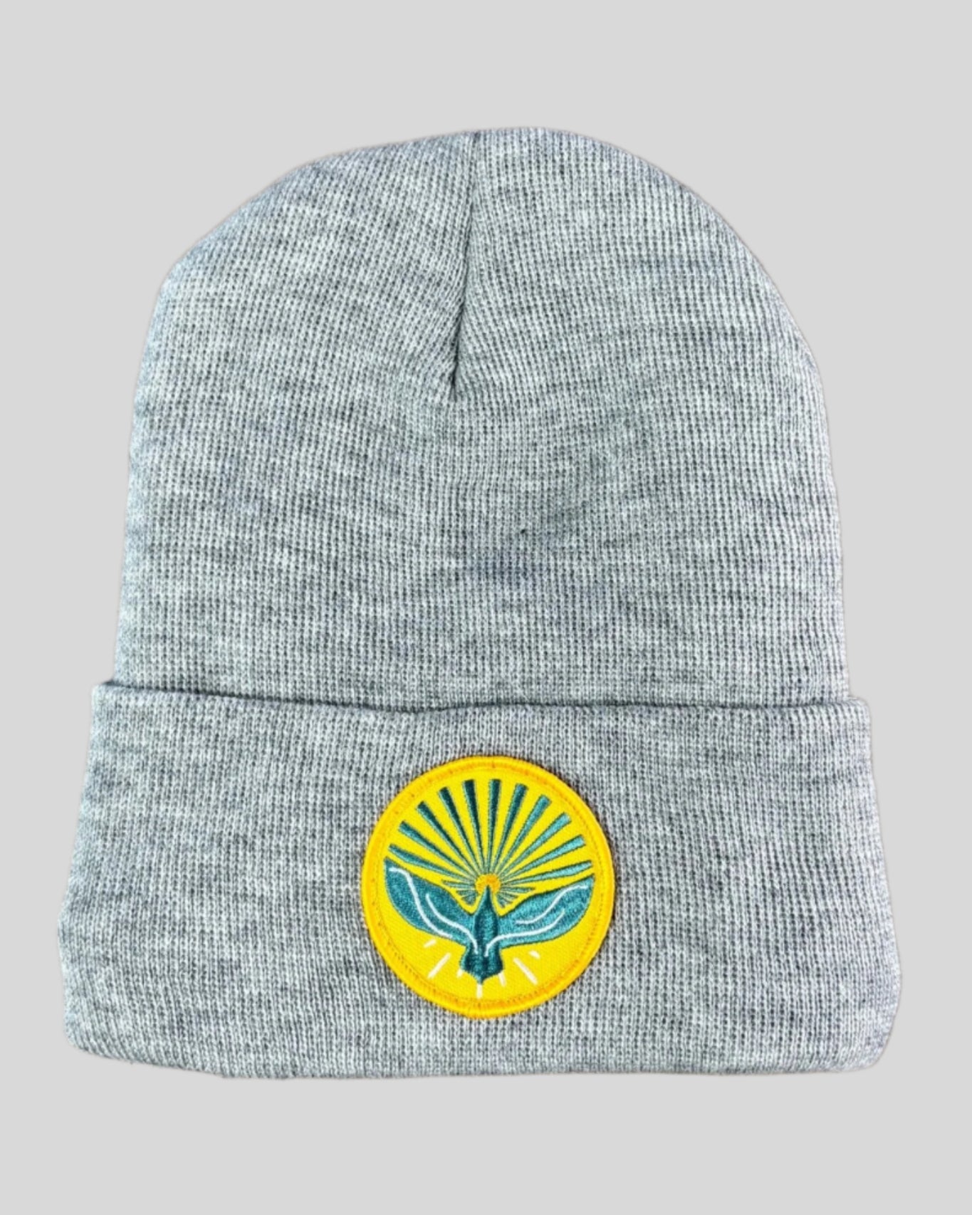 Heather gray winter hat with a pentecost patch