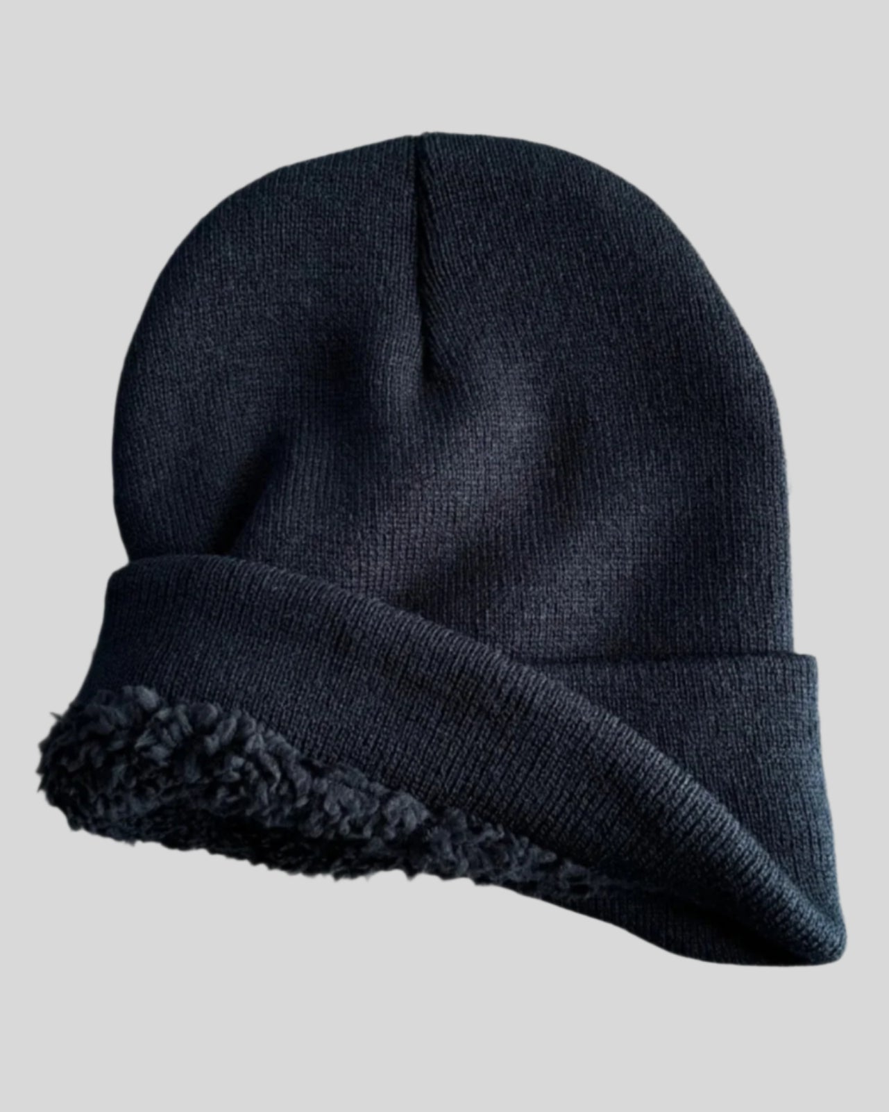 Interior of Black winter hat showing sherpa lining