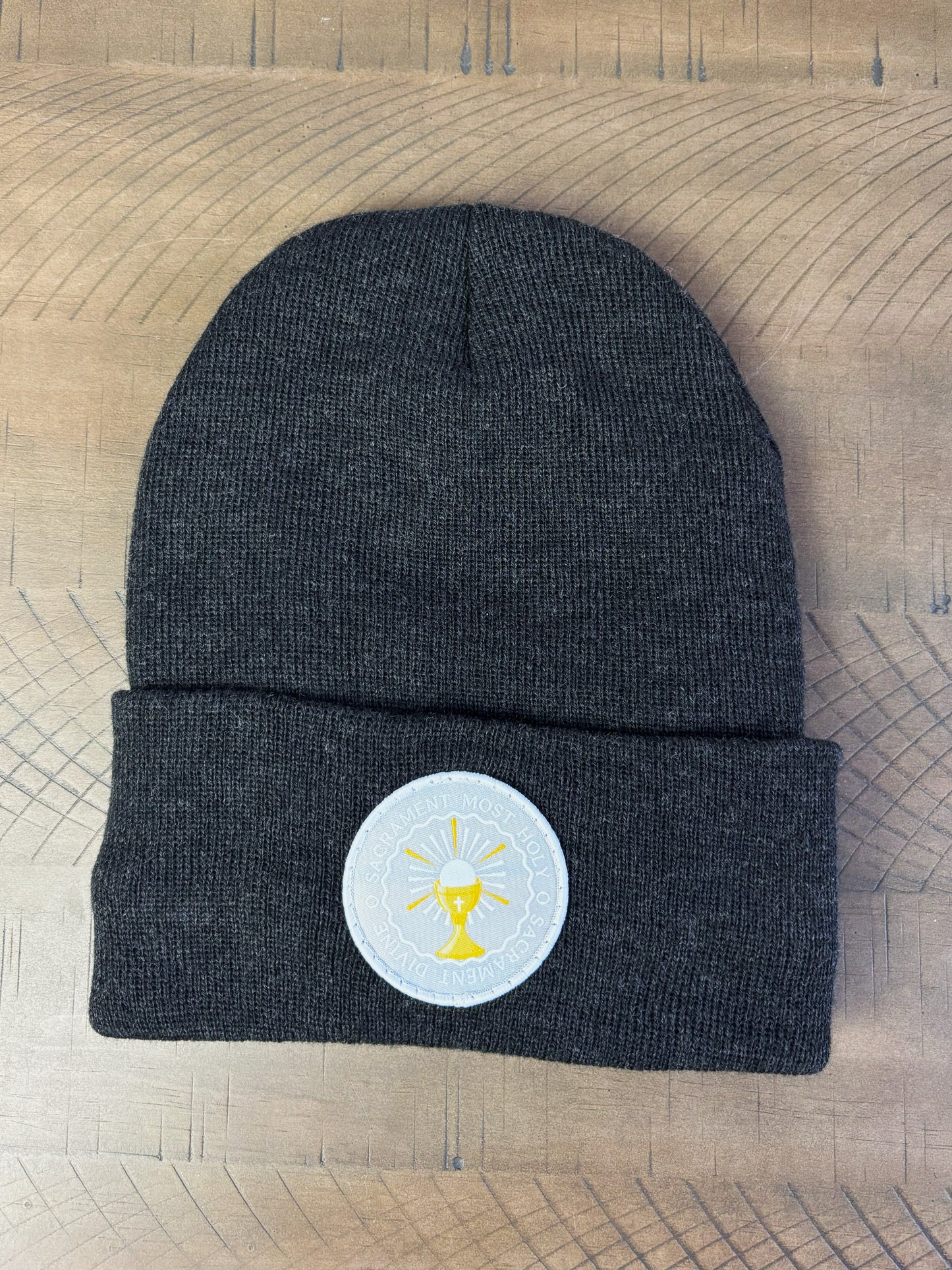 Heather charcoal winter hat with an o sacrament patch