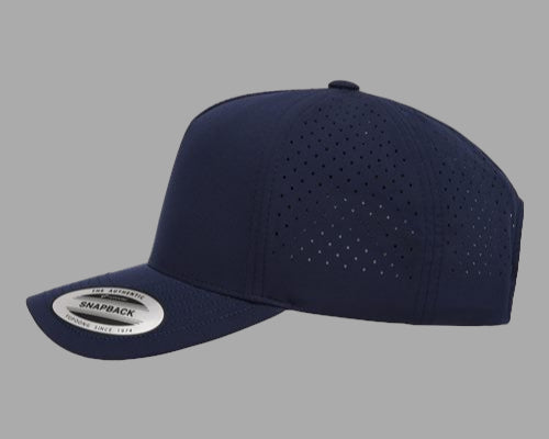 Navy blue cap with perforated design on a white background