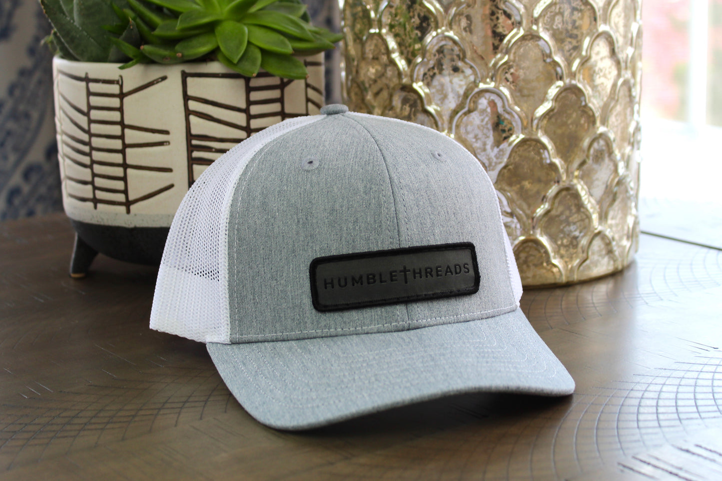 Heather gray/white youth snapback hat with humble threads patch