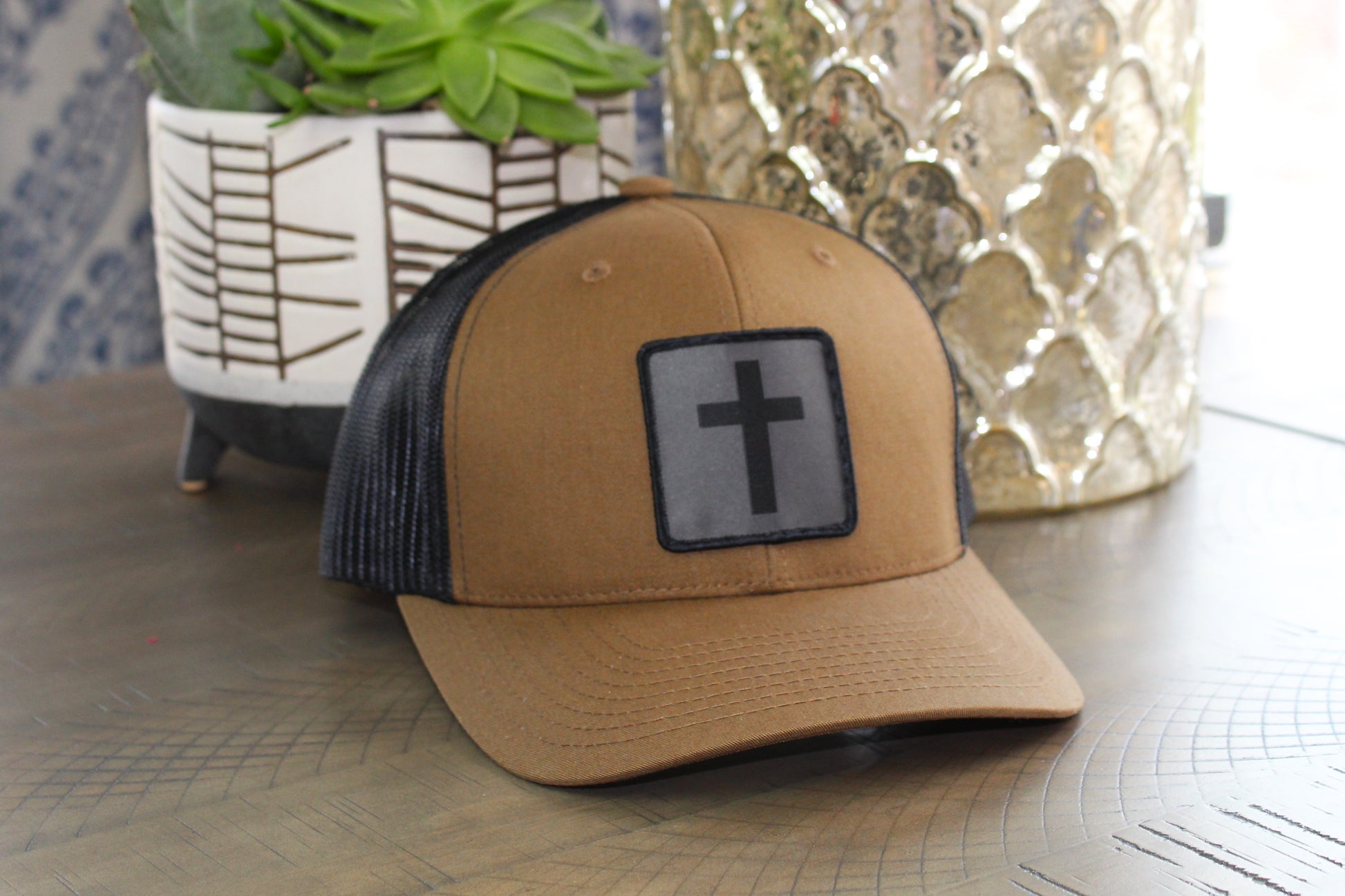 Coyote Brown/Black snapback with a humble threads cross patch