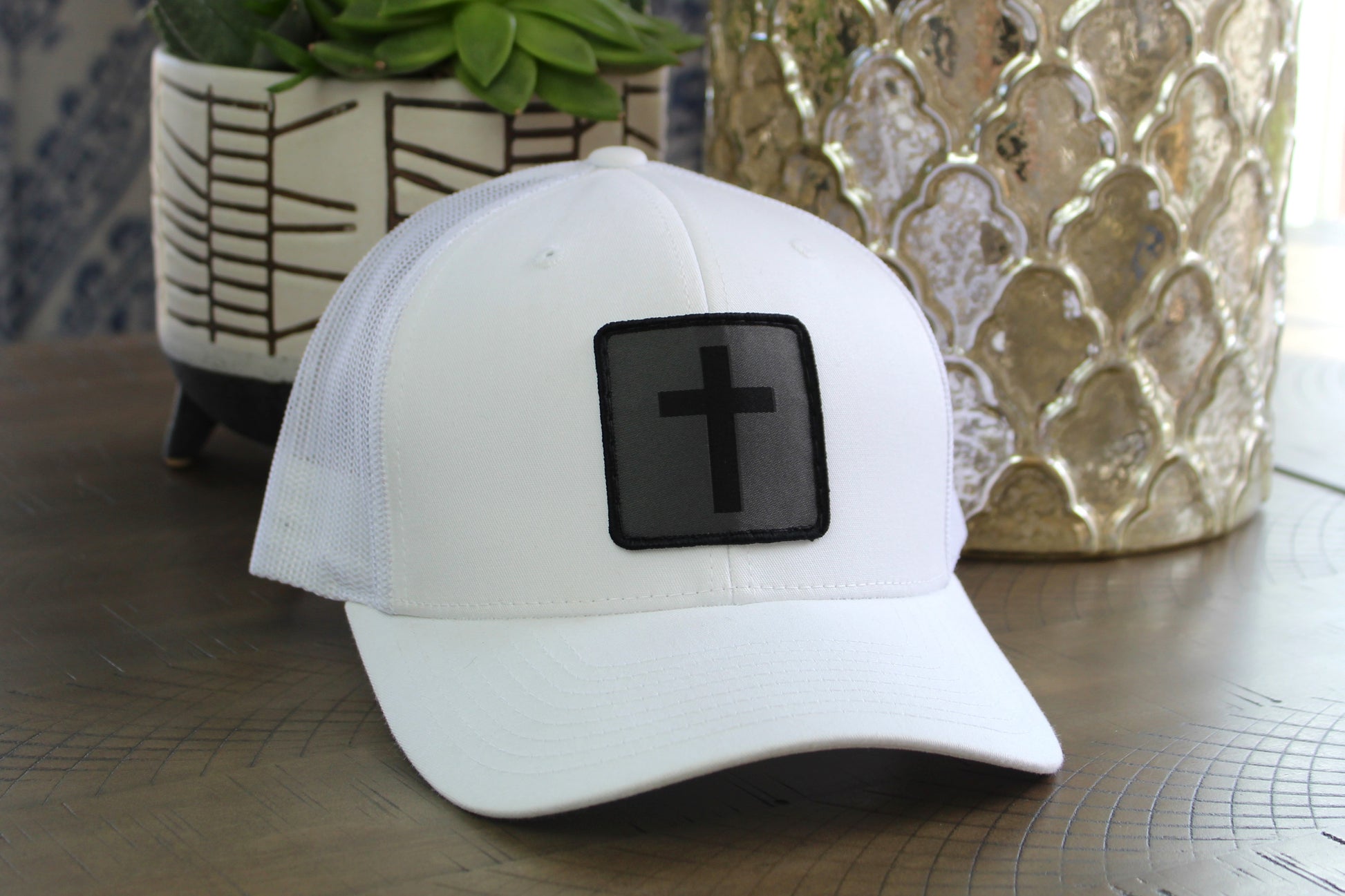 White snapback with a humble threads cross patch