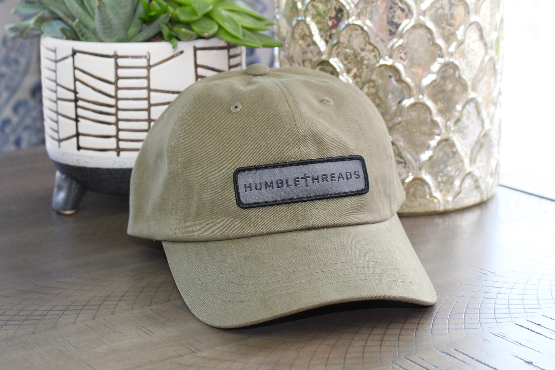 Olive adjustable hat with a humble threads patch