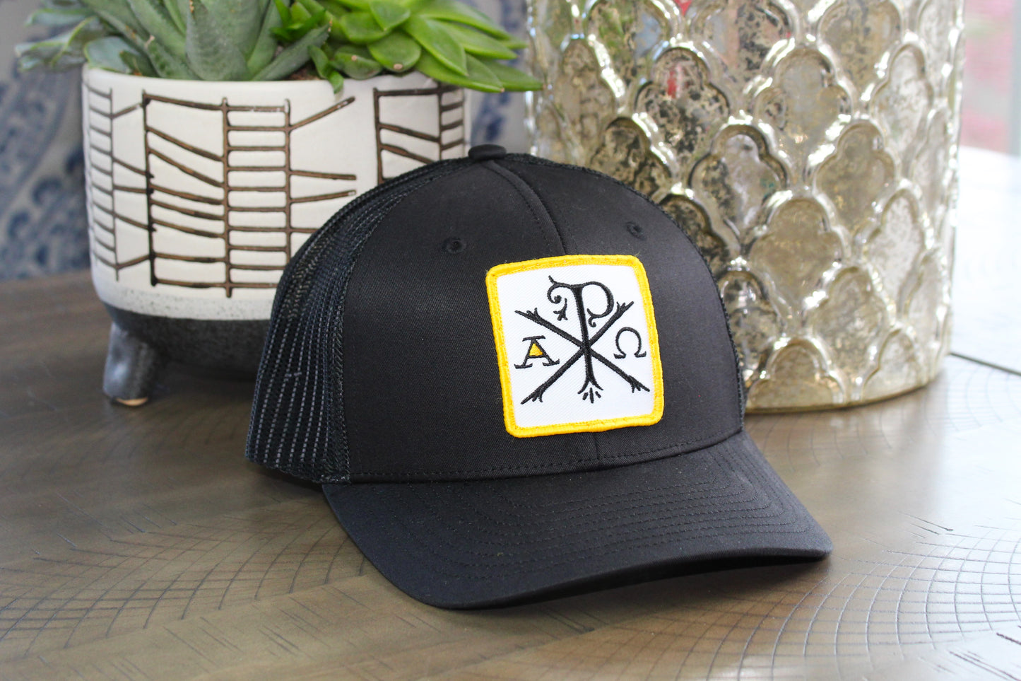 Black youth hat with Chi-Rho patch