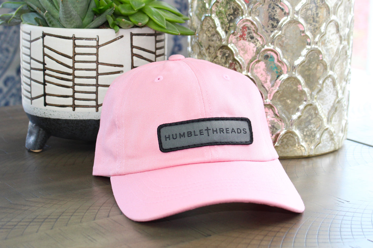Pink adjustable hat with a humble threads patch