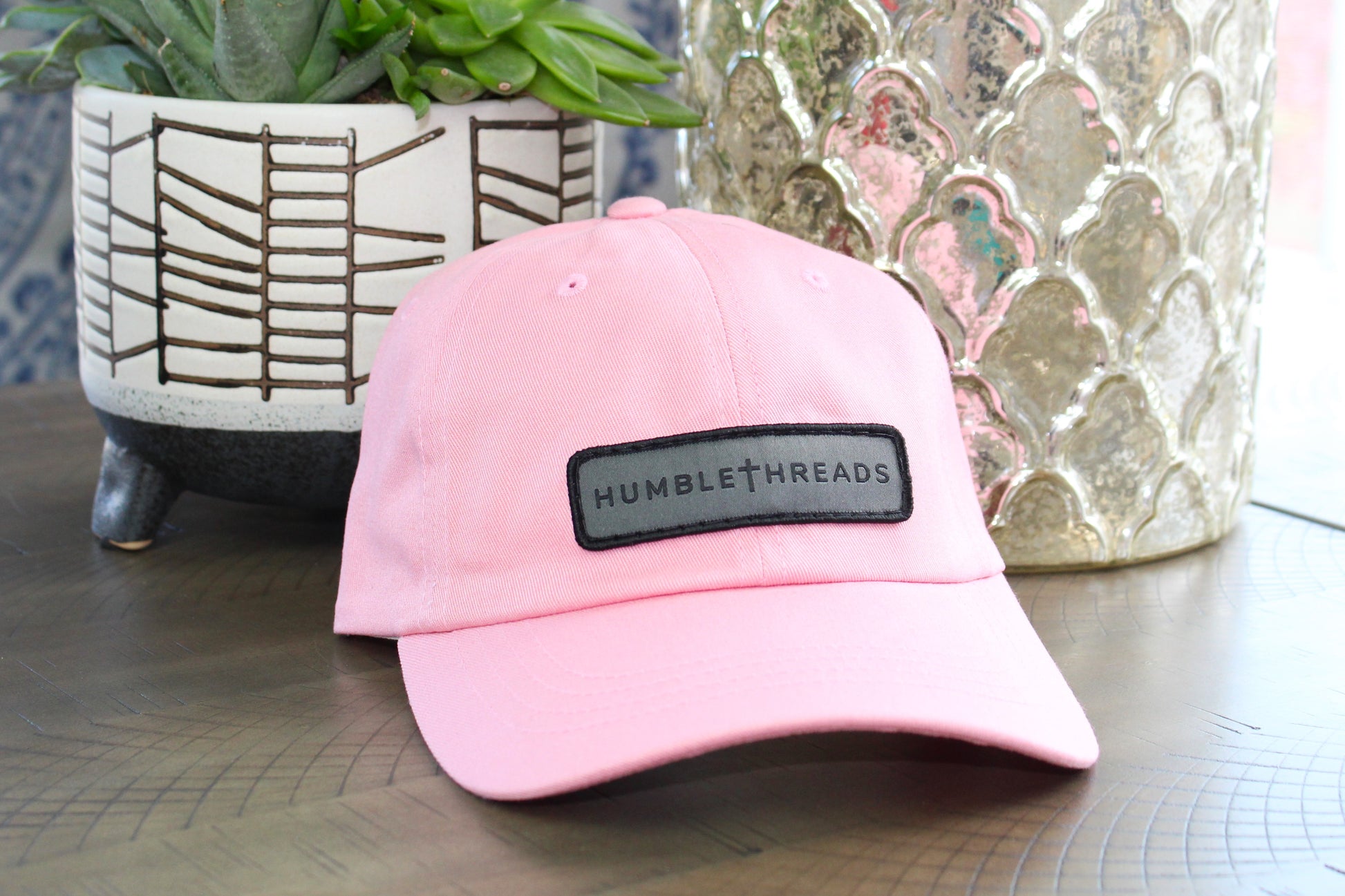 Pink adjustable hat with a humble threads patch