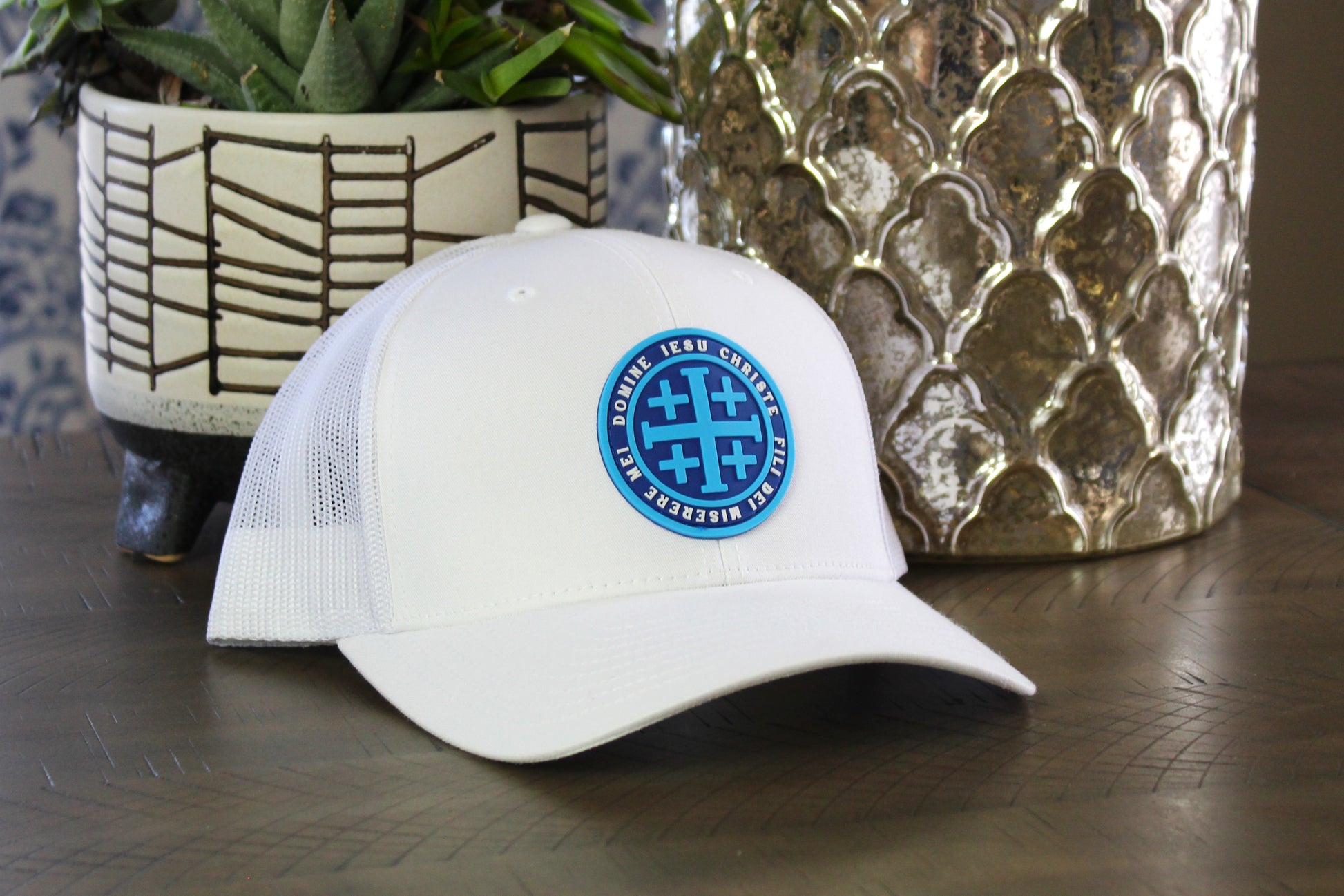White snapback with a Blue Jerusalem Cross patch