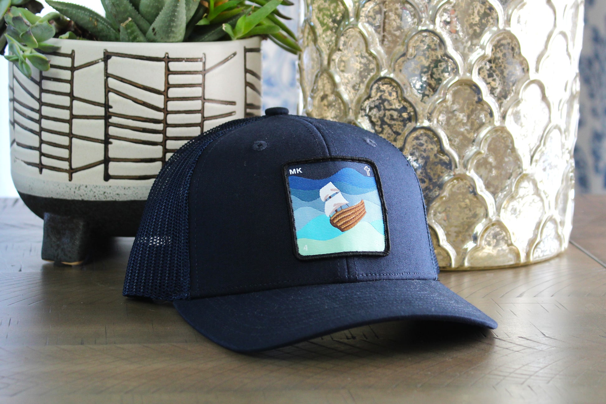 Youth Navy Snapback hat with a Jesus calms the storm patch