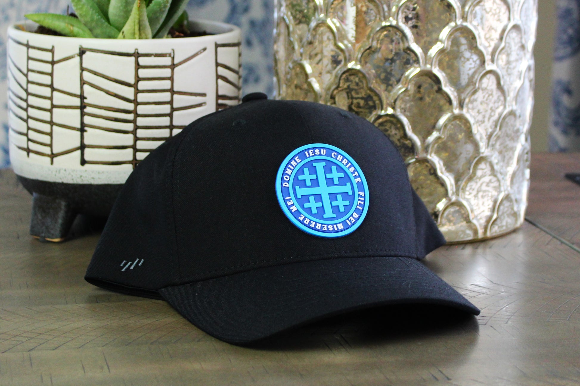Black Flexfit with a Blue Jerusalem Cross patch