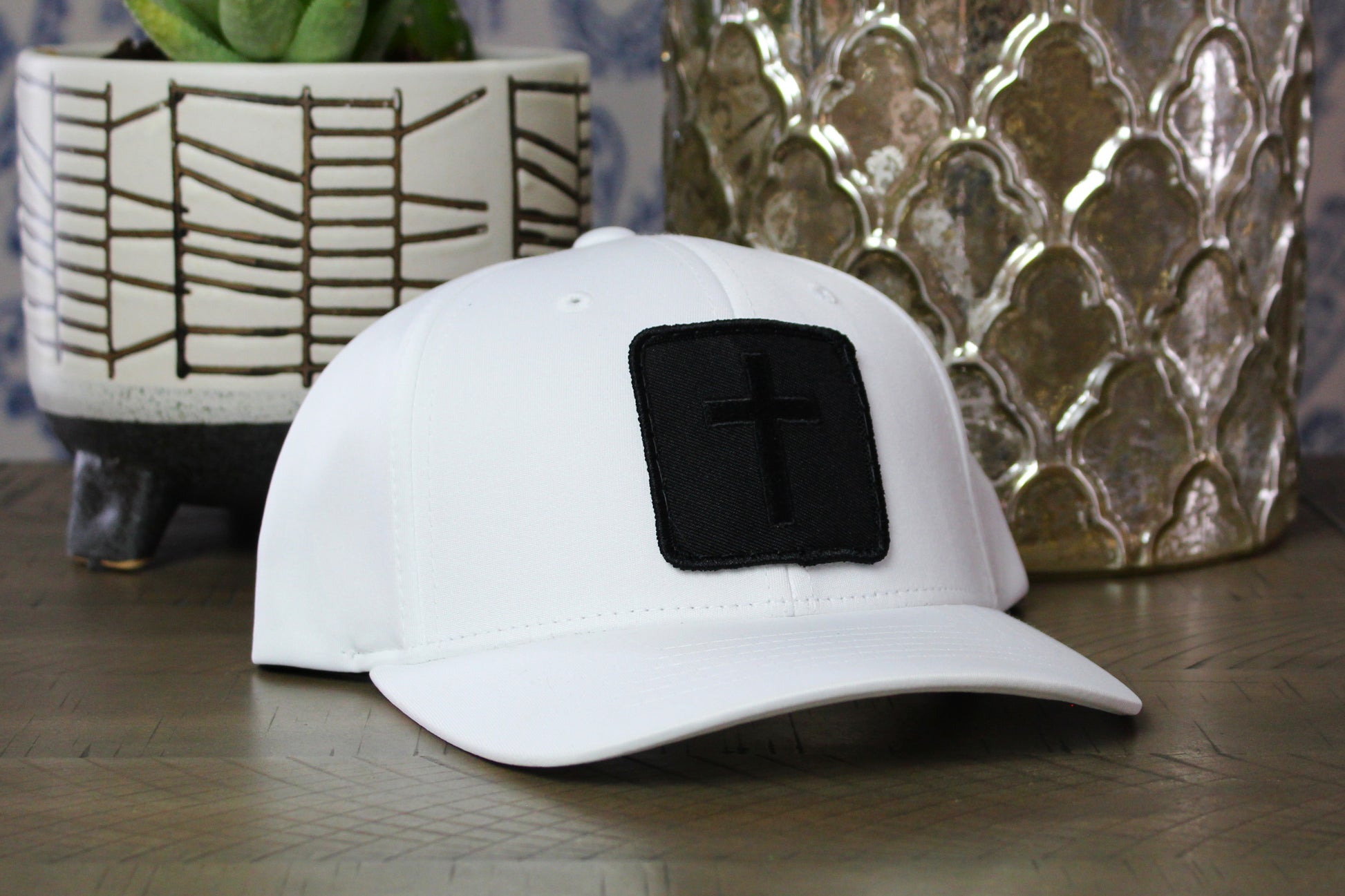 White youth snapback hat with Blackout Cross Patch
