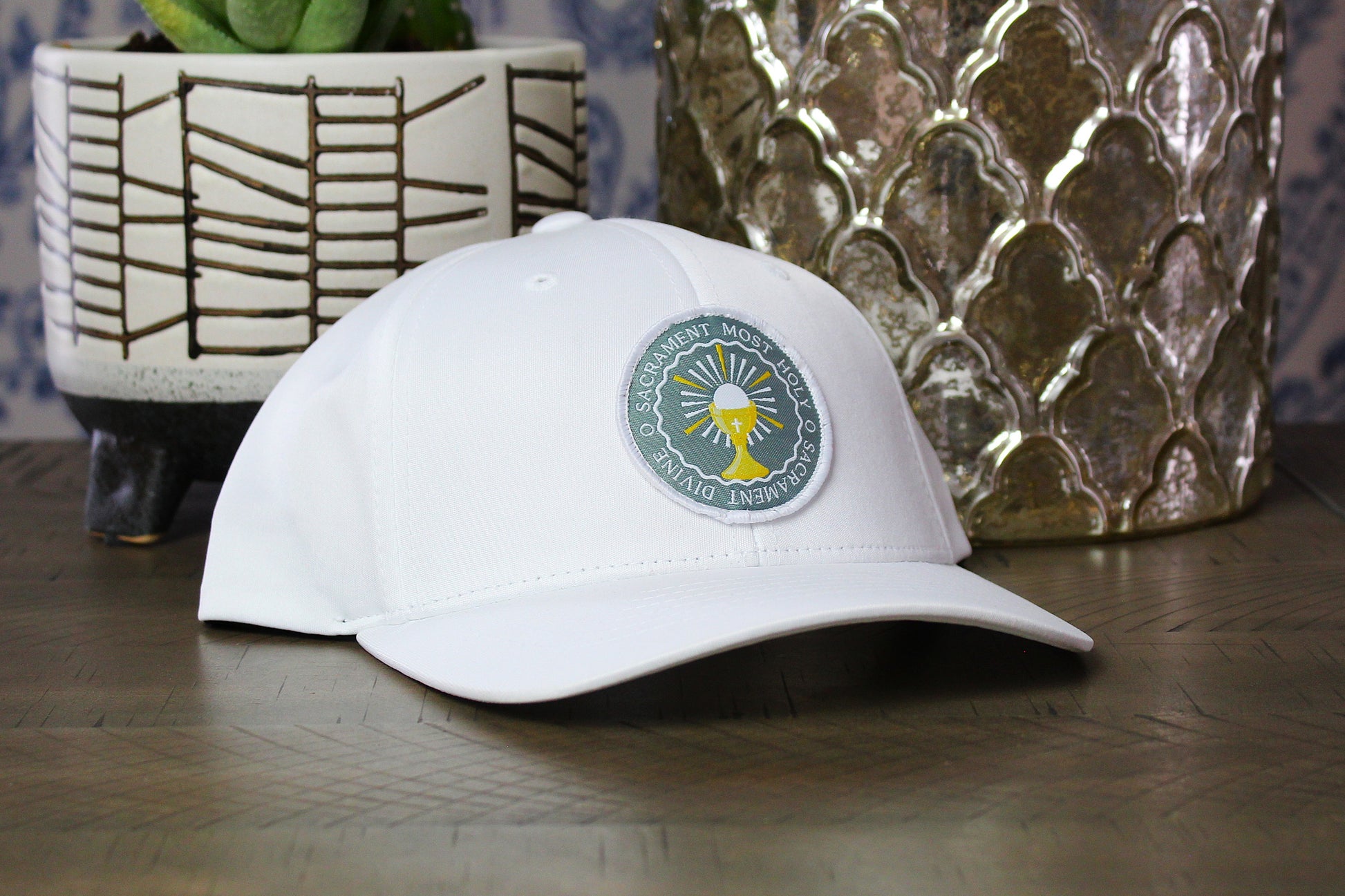 White youth snapback with an o sacrament patch