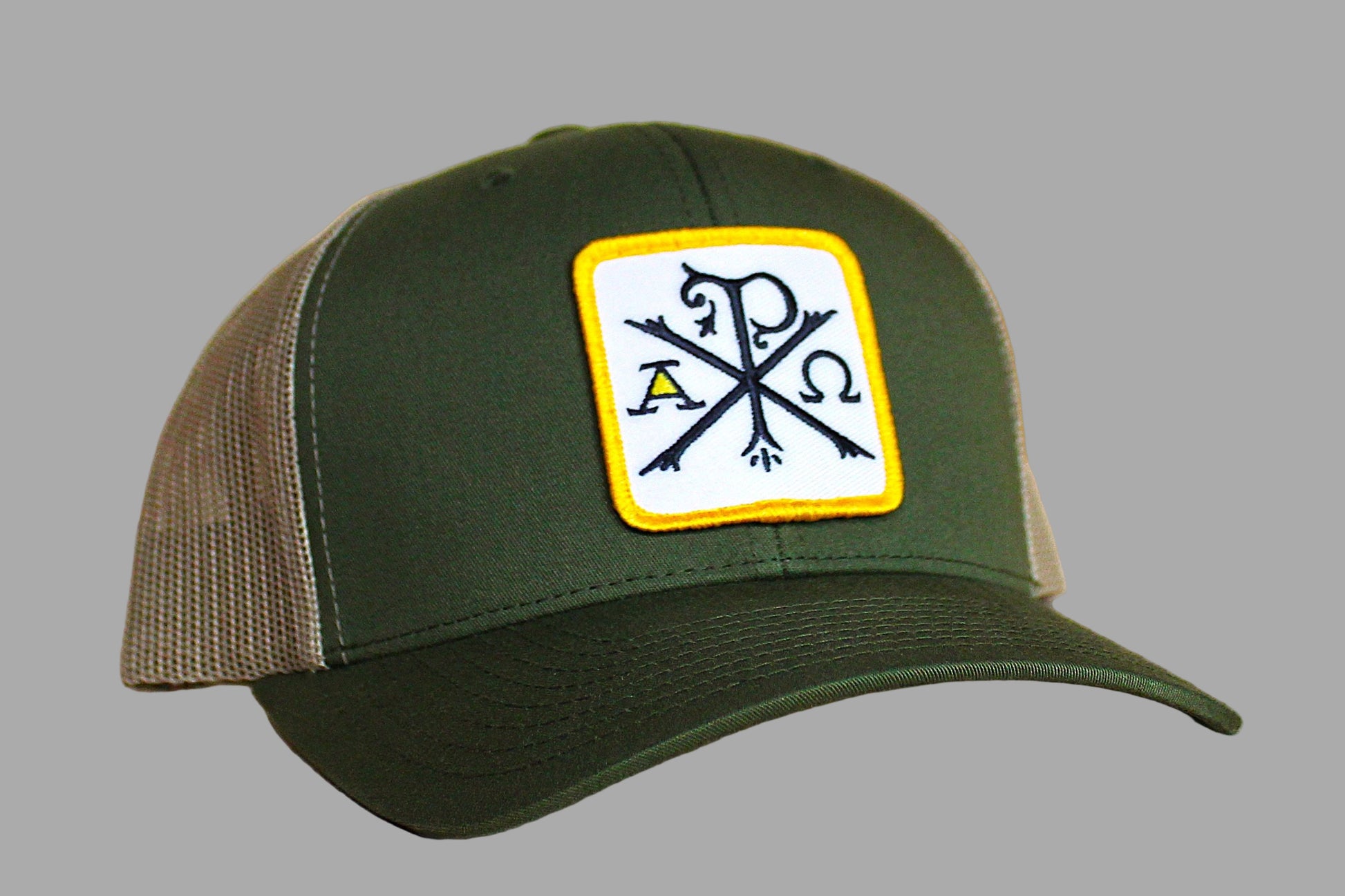 Green and brown cap with a logo patch on a gray background