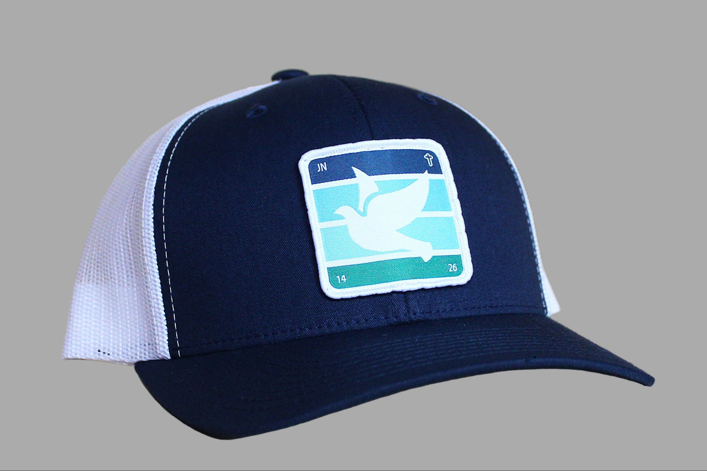 Navy blue and white cap with a logo on a gray background