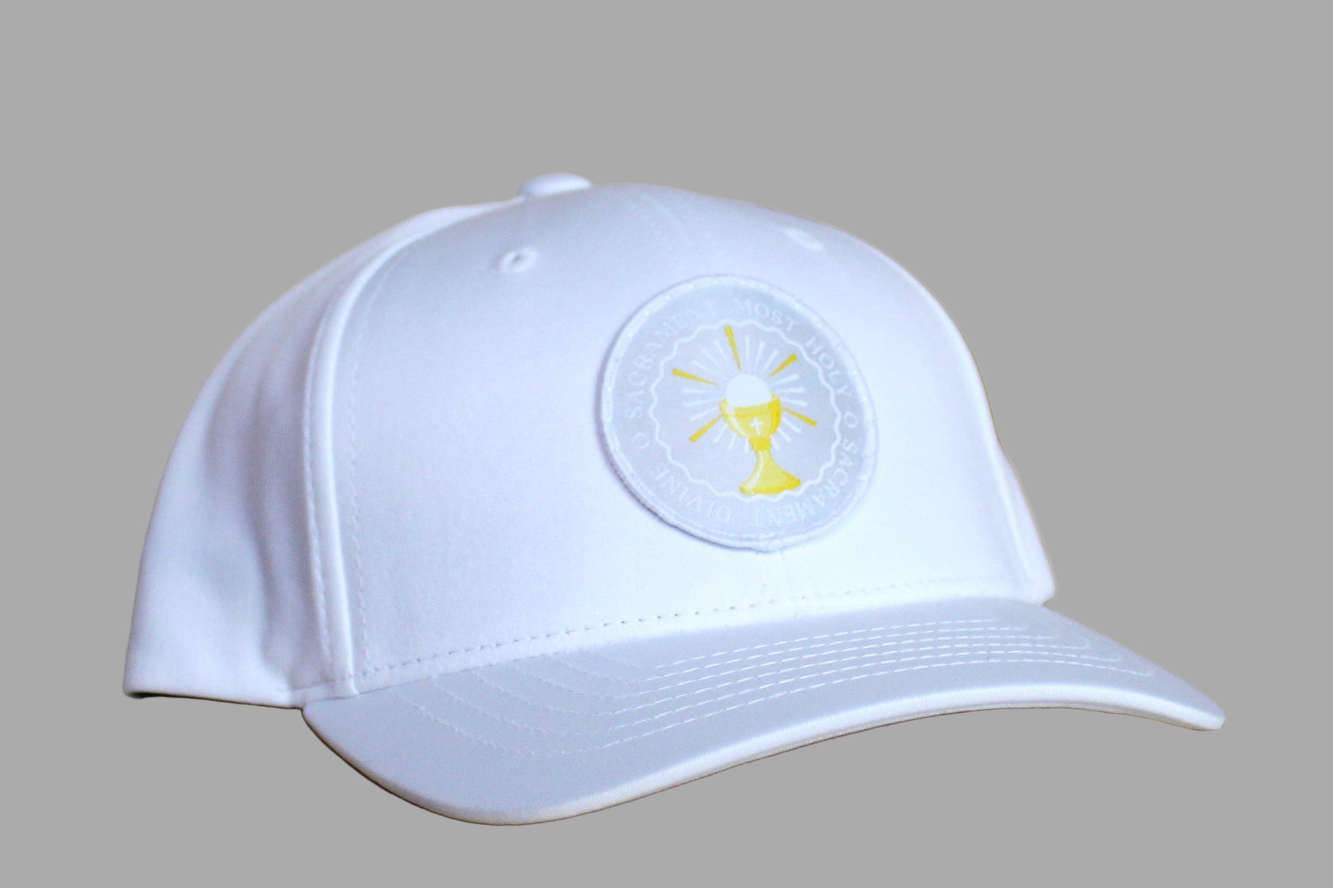White cap with a logo on a wooden surface