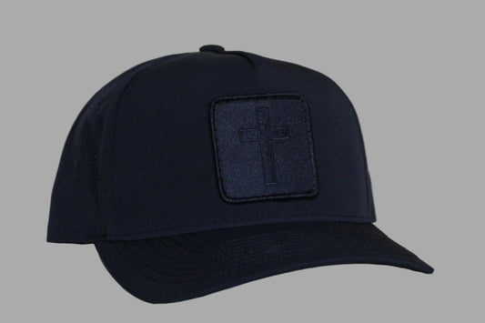 Black cap with a logo patch on a light background