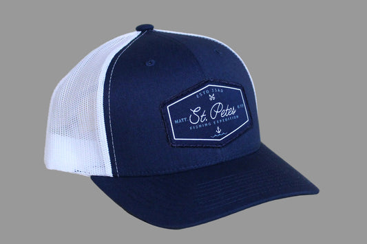 Navy and white cap with a logo 