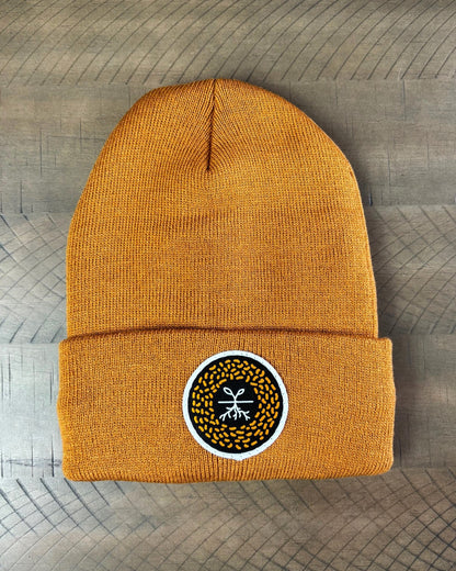 Carmel Brown winter hat with a mustard seed patch
