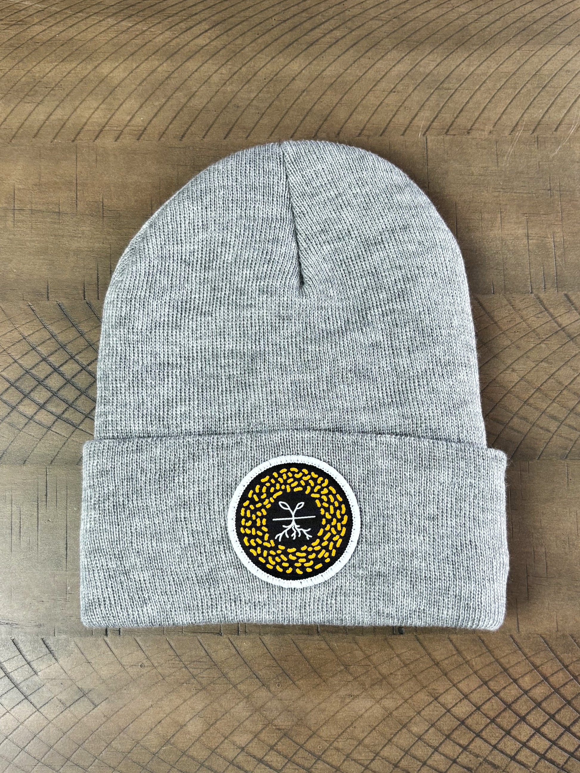 Heather gray winter hat with a mustard seed patch