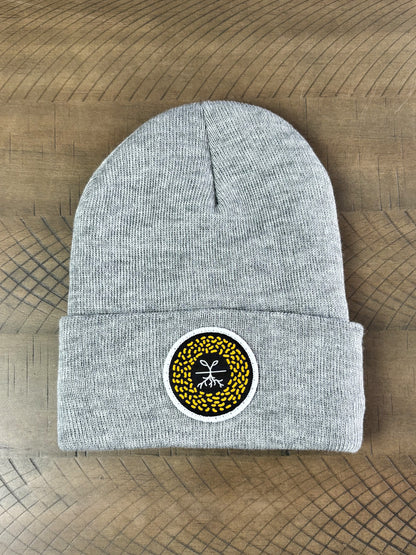 Heather gray winter hat with a mustard seed patch