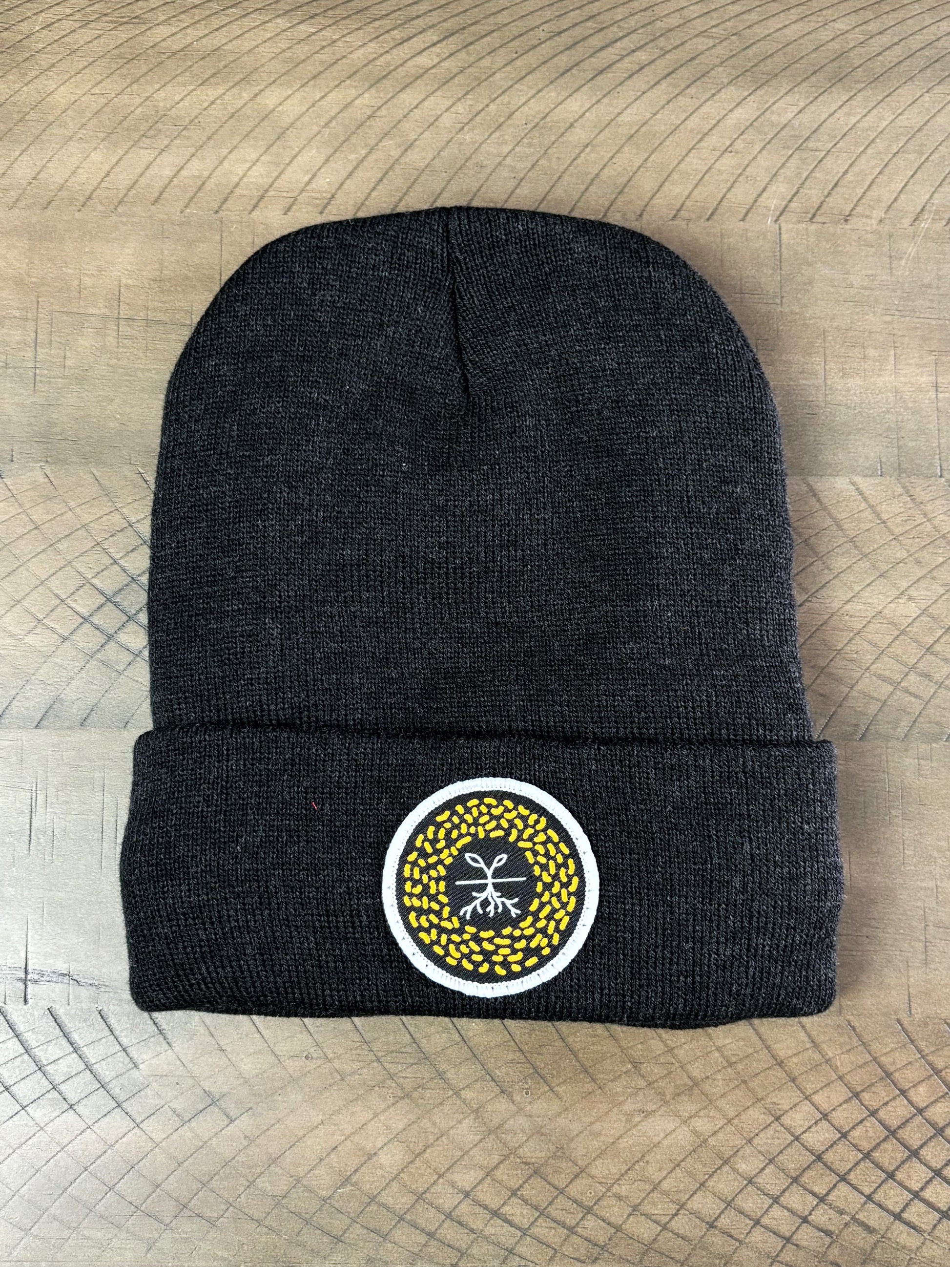 Heather Charcoal winter hat with a mustard seed patch