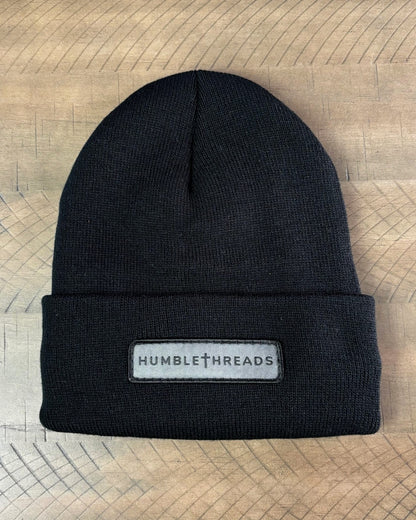 Black winter hat with a humble threads patch