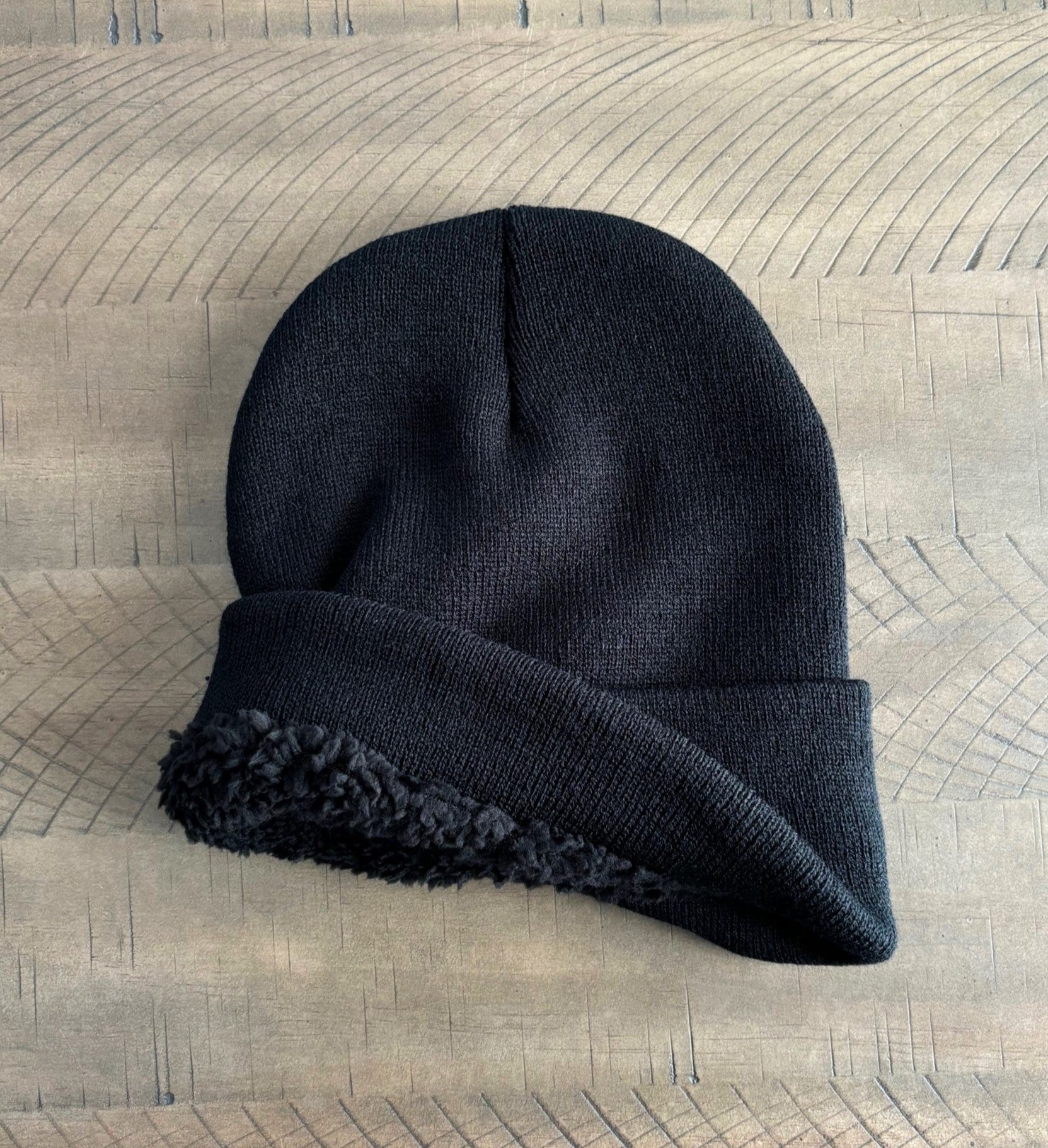 Interior of Black winter hat showing sherpa lining